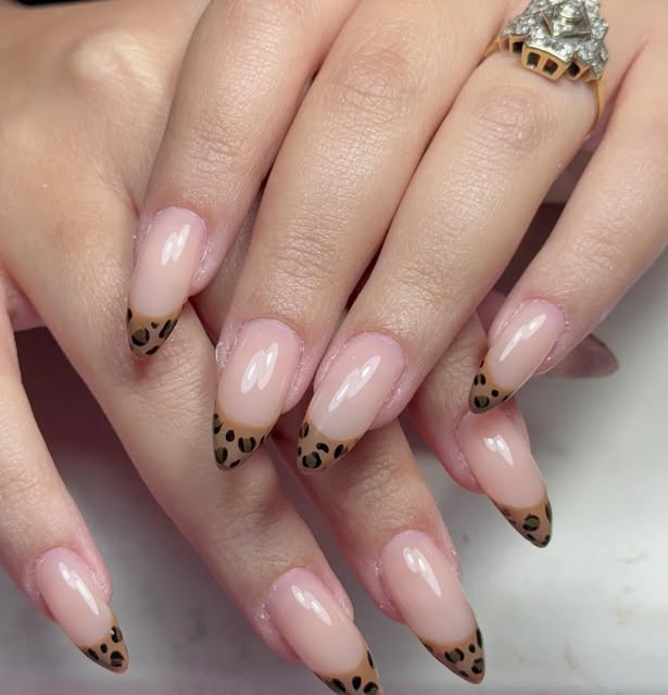 Soft pink nails with animal print tips