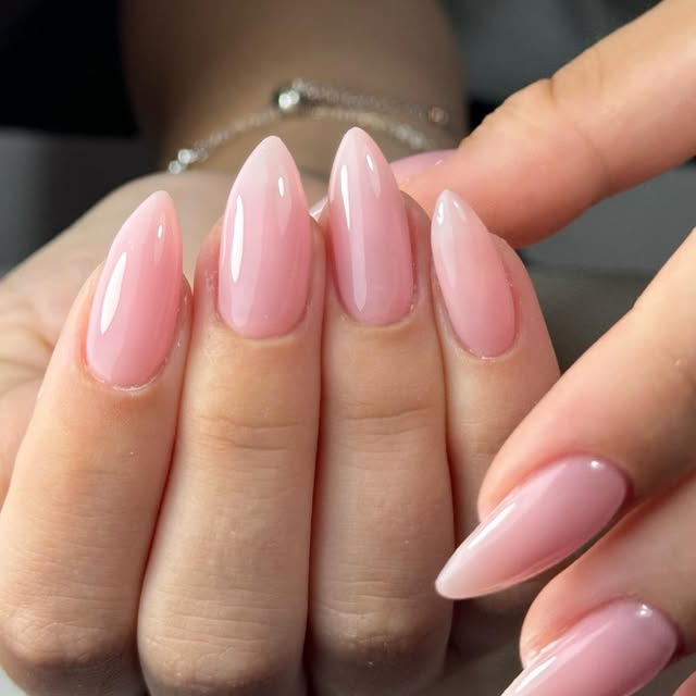 Glossy pink almond nails